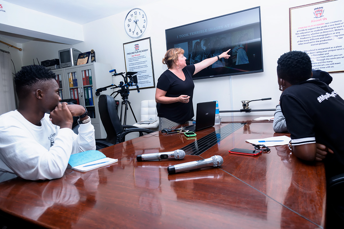 Joy Porter teaching Graphics students in the class room at Proline Film Academy